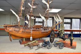A MODEL OF HMS BOUNTY AND MODEL CANNONS, a late twentieth century wooden model ship by Maquettes
