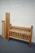 A 4FT6 PINE BEDSTEAD, with side rails and slats