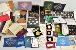 A CARDBOARD BOX OF MIXED COINS AND YEAR SETS, to include five UK royal mint proof year sets 1983,