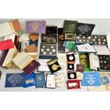 A CARDBOARD BOX OF MIXED COINS AND YEAR SETS, to include five UK royal mint proof year sets 1983,