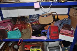 A GROUP OF HANDBAGS AND PURSES, to include a small brown Radley bag with dust cover, three Kipling