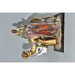 A COLD PAINTED SPELTER TABLE LIGHTER IN THE FORM OF TWO FIGURES WITH A CAMEL, in the style of