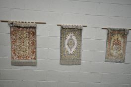 THREE SMALL 20TH CENTURY SILK TAPESTRIES, of various patterns and colours, largest tapestry 47.5cm x