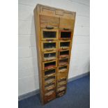 A 20TH CENTURY OAK TWENTY DRAWER HABERDASHERY CABINET, width 66cm x depth 33cm x height 190cm (