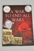A PLASTIC PACKET CONTAINING A FOLDER OF A WAR TO END ALL WARS, included are 5x coins in the