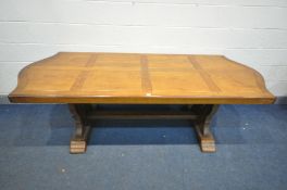 A HEAVY OAK TRESTLE DINING TABLE, with serpentine ends, length 230cm x depth 96cm x height 77cm (