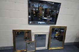 A DECORATIVE BEVELLED EDGE MIRROR, with a mirrored frame, 108cm x 77cm, along with a gilt framed