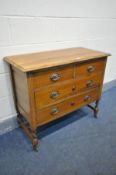 AN EARLY 20TH CENTURY OAK CHEST OF FOUR DRAWERS, on barley twist legs and casters, width 91cm x