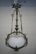 AN EARLY 20TH CENTURY FRENCH BRASS CHANDELIER, with a white shade, diameter 62cm x drop 110cm (