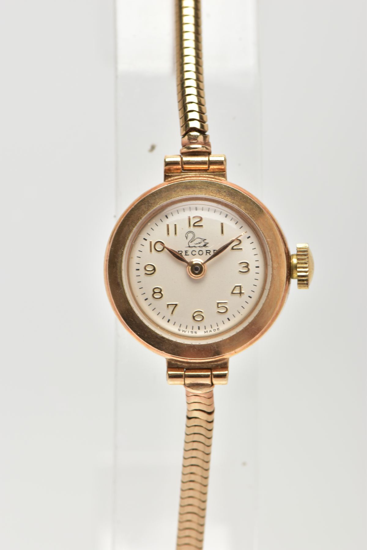 A 9CT GOLD LADIES WRISTWATCH, a hand wound movement, round white dial signed 'Record', Arabic
