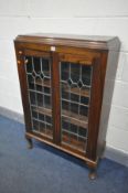 AN OAK LEAD GLAZED TWO DOOR BOOKCASE, on cabriole legs, width 76cm x depth 30cm x height 117cm