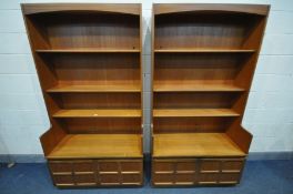 A PAIR OF NATHAN TEAK BOOKCASES, with double cupboard doors, width 102cm x depth 46cm x height 194cm