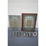 A PAIR OF LEAD GLAZED STAINED GLASS WINDOWS, one within mahogany frame, minus frame, 46cm x 67cm,