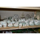 A ONE HUNDRED AND EIGHTY SEVEN PIECE MINTON HADDON HALL DINNER SERVICE, comprising fifteen dinner