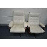 A NEAR PAIR OF BUTTONED CREAM LEATHERETTE SWIVEL ARMCHAIRS, on stained beech frame and stand,