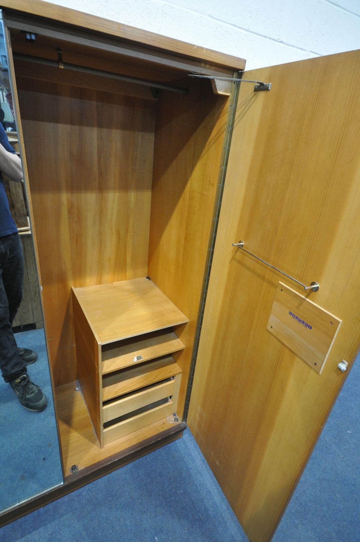 A MID-CENTURY UNIFLEX TEAK TWO PIECE BEDROOM SUITE, comprising a dressing table with a triple mirror - Image 4 of 4