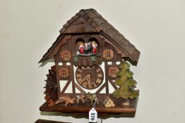A LATE 20TH CENTURY SCHNEIDER MUSICAL CUCKOO CLOCK, approximate height 35cm, in need of some