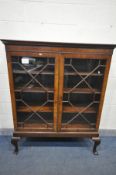 A CHIPPENDALE STYLE MAHOGANY GLAZED TWO DOOR BOOKCASE, three shelves, on front cabriole legs, length