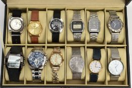 A WATCH DISPLAY CASE WITH WATCHES, black faux leather case with twelve watch storage spaces and