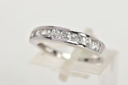 A 9CT GOLD HALF ETERNITY RING, a white gold band ring, channel set with eight circular cut