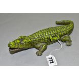 A VINTAGE CAST IRON CIGARETTE/VESTA CASE, in the form of a crocodile, with hinged lid revealing