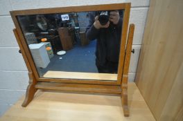 A 1930'S OAK SWINGING DRESSING MIRROR, possibly by Heals & Sons, width 61cm x depth 26cm x height