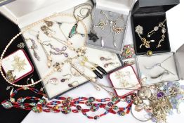 A SELECTION OF SILVER AND WHITE METAL JEWELLERY AND TWO COINS, to include pendant necklaces, a white