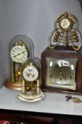 FOUR CLOCKS, comprising an art nouveau style brass cased Ansonia mantel clock, the enamel dial set
