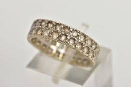 A WHITE METAL FULL ETERNITY RING, wide band set with two rows of colourless spinels, approximate