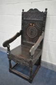 AN 18TH CENTURY CARVED OAK WAINSCOTE CHAIR, with scrolls surrounding a geometric decorated panel,