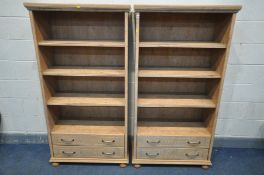 A PAIR OF MODERN LIGHT WOOD OPEN BOOKCASES, with two drawers, width 87cm x depth 40cm x height 163cm