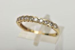 AN 18CT GOLD HALF ETERNITY RING, a yellow gold semi bezel set half eternity ring, set with ten round