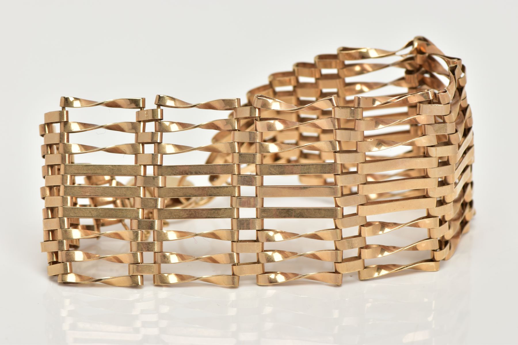 A 9CT GOLD GATE BRACELET, nine row gate bracelet, comprising of six twisted bars and three - Image 3 of 3
