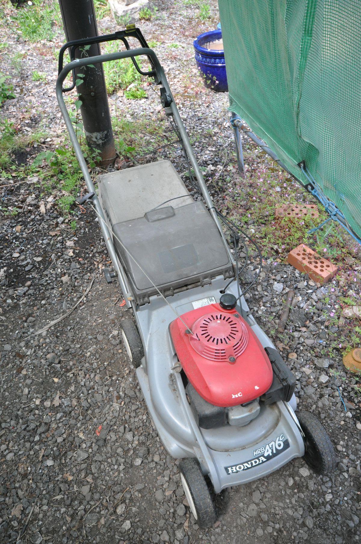 A HONDA HRB 476C PETROL LAWNMOWER with grass box (engine pulls freely but not fully tested)