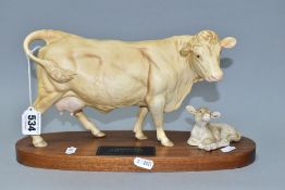 A BESWICK CHAROLAIS COW AND CALF ON A WOODEN PLINTH, model no.A2648/2652, satin matt glaze (