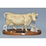 A BESWICK CHAROLAIS COW AND CALF ON A WOODEN PLINTH, model no.A2648/2652, satin matt glaze (