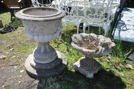 A COMPOSITE URN, with lion faces and fluted bottom on a separate base and plinth, diameter 55cm x