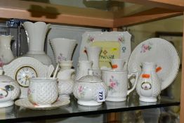 A COLLECTION OF DONEGAL AND BELLEEK CHINA, approximately thirty pieces to include a Belleek