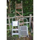 A SET OF 2M WOODEN STEP LADDERS with a set of aluminium step ladders and another pair (3)