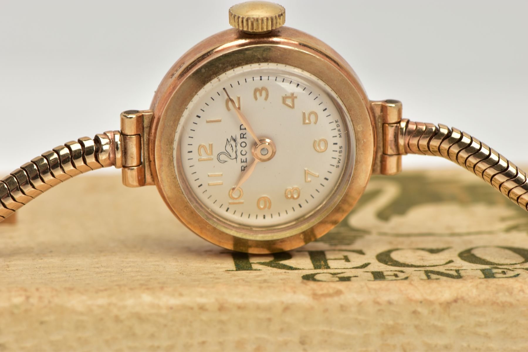 A 9CT GOLD LADIES WRISTWATCH, a hand wound movement, round white dial signed 'Record', Arabic - Image 4 of 6