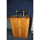 A SINGER 15K SEWING MACHINE with power cable and pedal (mounted on walnut cabinet with box of