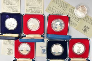 A SELECTION OF CROWN SIZED SILVER PROOF COINS MOSTLY CELEBRATING THE QUEENS JUBILEE IN 1977, to