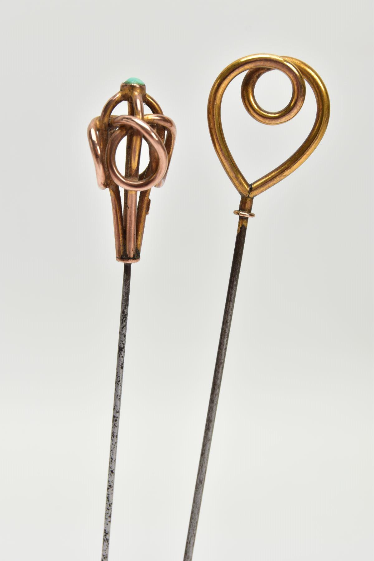 TWO EARLY 20TH CENTURY HAT PINS, one designed as a stylised knot with turquoise cabochon accent, one