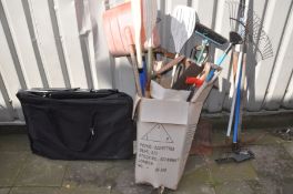 A FOLDING GARDEN LOUNGER CHAIR and storage bag, along with a box containing various hand tools, to