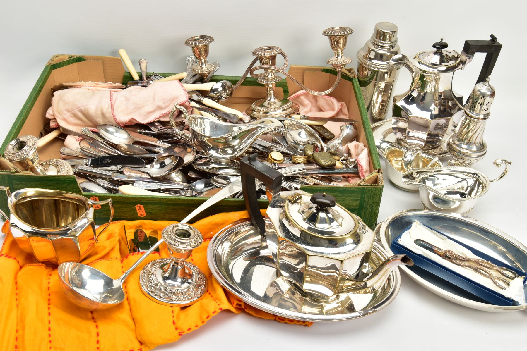 A BOX OF ASSORTED WHITE METAL TABLEWARE, to include a three branch candlestick, a wick cutter, a tea