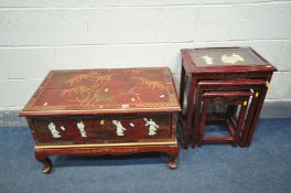 A RED LAQUERED JAPANNED NEST OF THREE TABLES, with chinoiserie detail, and glass tops, largest table