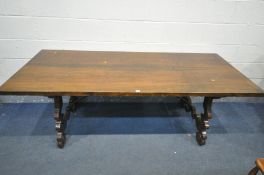 A 20TH CENTURY SPANISH WALNUT REFECTORY TABLE, on a pair of shaped trestle legs, united by a pair of