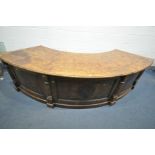 A GOOD QUALITY 20TH CENTURY OAK AND POLLARD OAK CURVED PEDESTAL DESK, the top with book matched