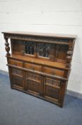 AN OLD CHARM OAK COURT CUPBOARD, with three drawers, width 138cm x depth 47cm x height 137cm (