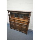 AN OLD CHARM OAK COURT CUPBOARD, with three drawers, width 138cm x depth 47cm x height 137cm (